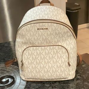 Michael Kors backpack, beige and tan color, 14” H X 12” W, gently used condition